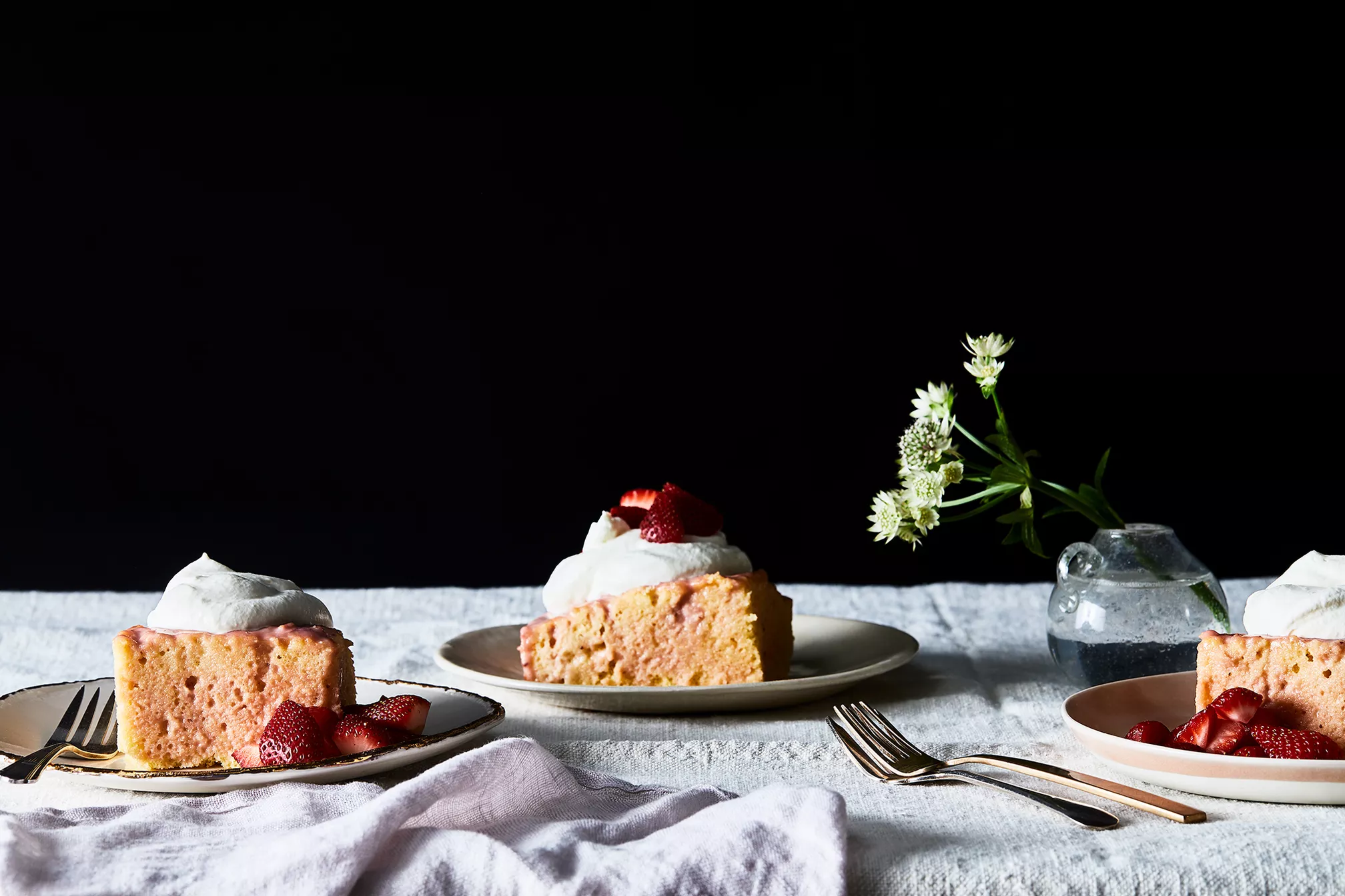 Strawberry Rhubarb Tres Leches Mother's Day Cake on brunch spread